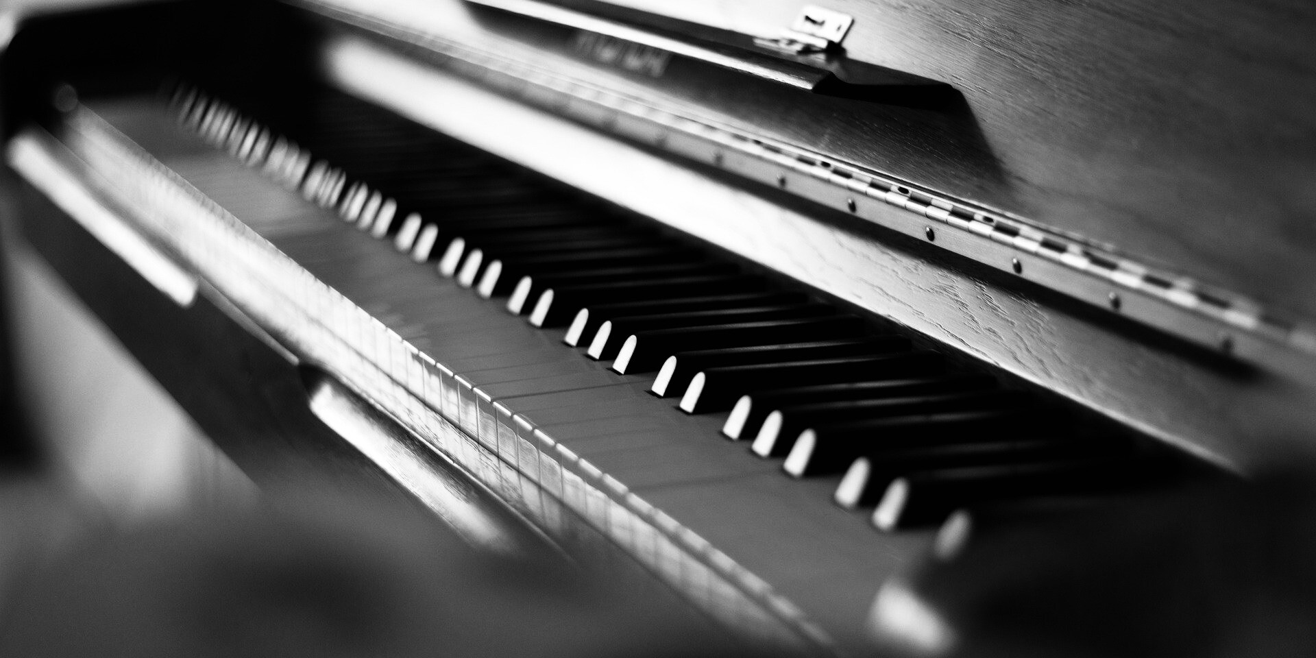 Image by Fabian Dück on Pixabay is a closeup of a piano keyboard in black and white